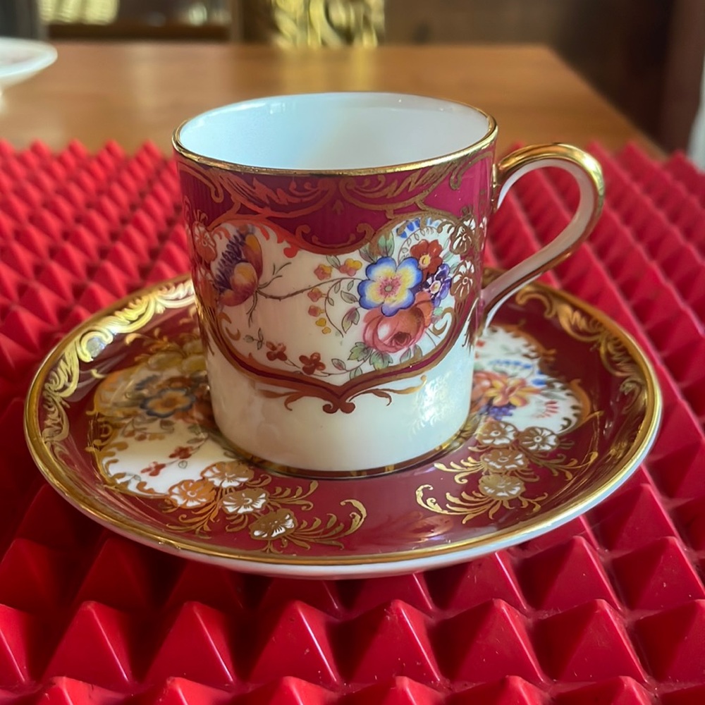 SPECTACULAR ANTIQUE MAROON AND GOLD DEMITASSE TEACUP AND SAUCER